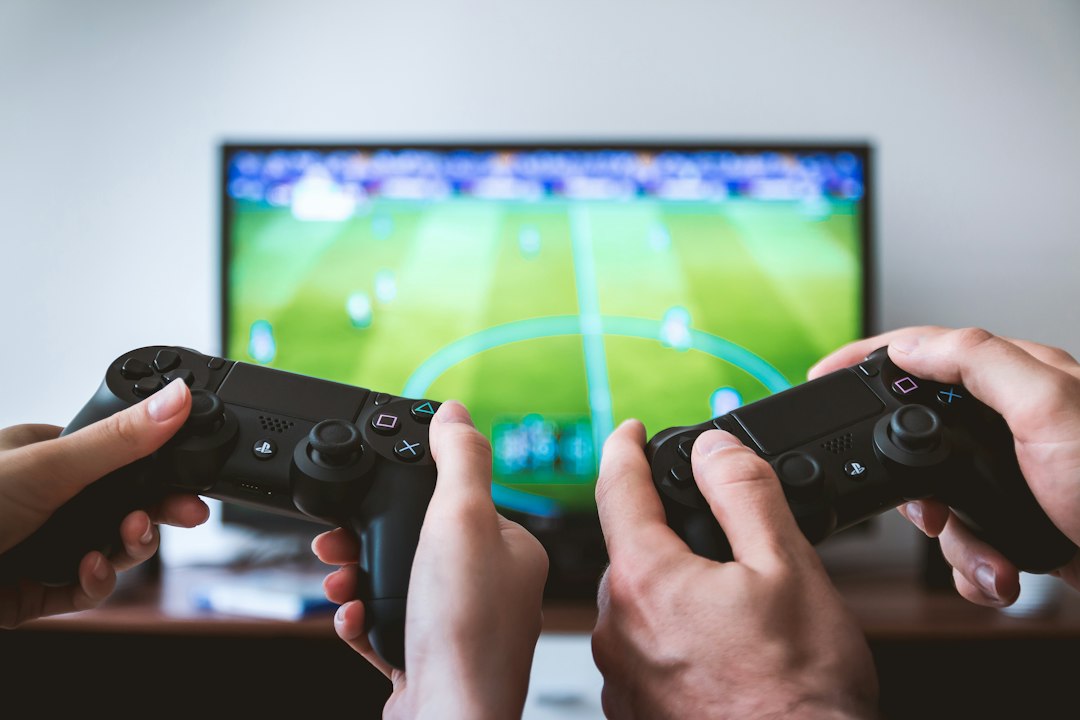 Hands holding the game controllers